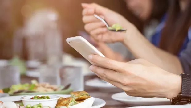 Parents actually spend more time on smartphones during family meals than their kids, study shows